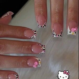 Sanrio Hello Kitty Nail Art with Pink and Black Accents